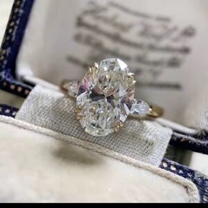 18k Gold Finish Oval Solitaire Ring in Yellow Gold with Side Marquise Accents